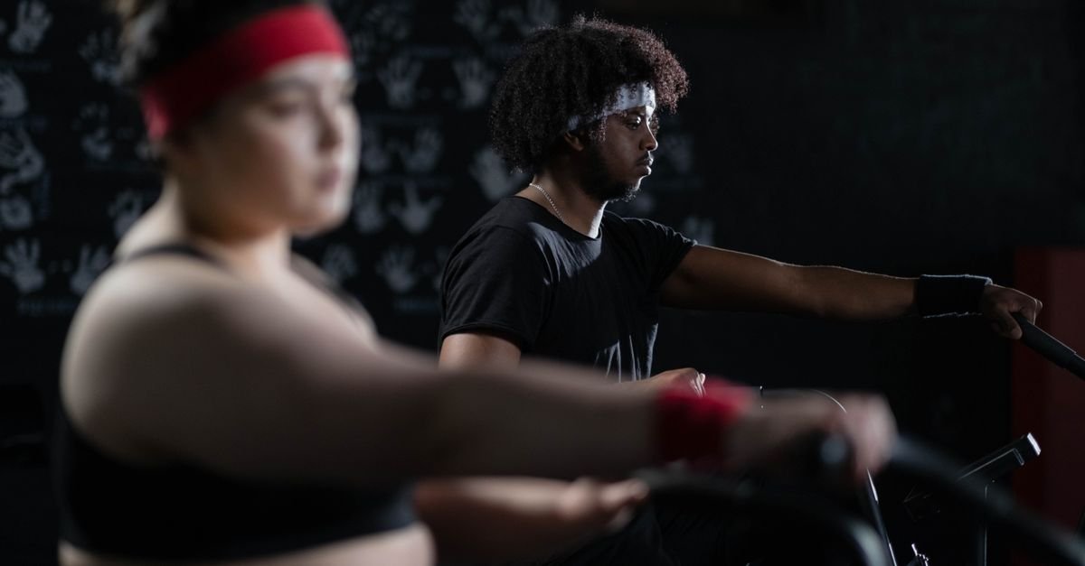 Dedicated gym-goers engaged in fitness training, emphasizing energy and focus.