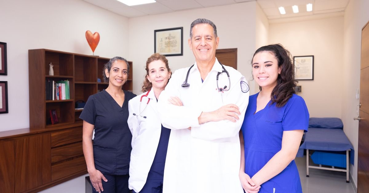 Group of diverse healthcare professionals in a clinical setting, showcasing teamwork and care.